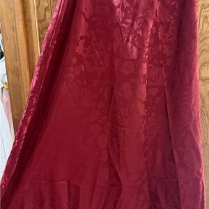 Urban Outfitters burgundy silk skirt with floral pattern.